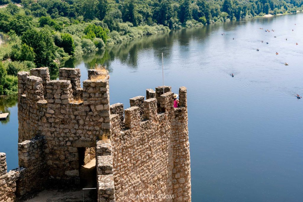 A woman in pink in the Almourol Castle in Central Portugal
