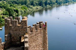 A woman in pink in the Almourol Castle in Central Portugal