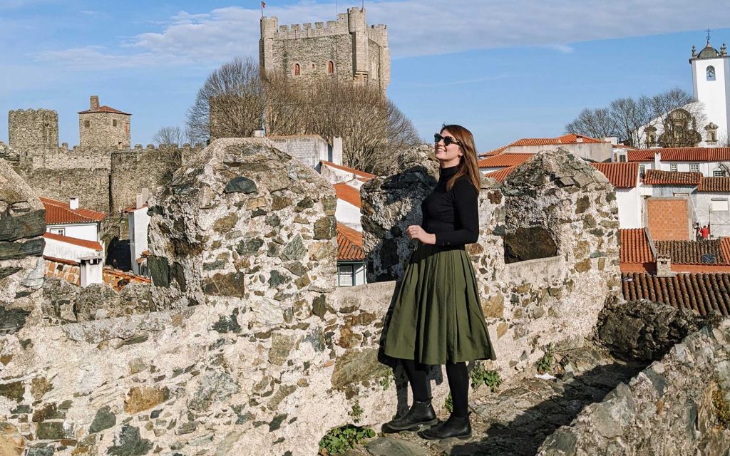 Daniela standing on the castle wall in Bragança on a sunny February day
