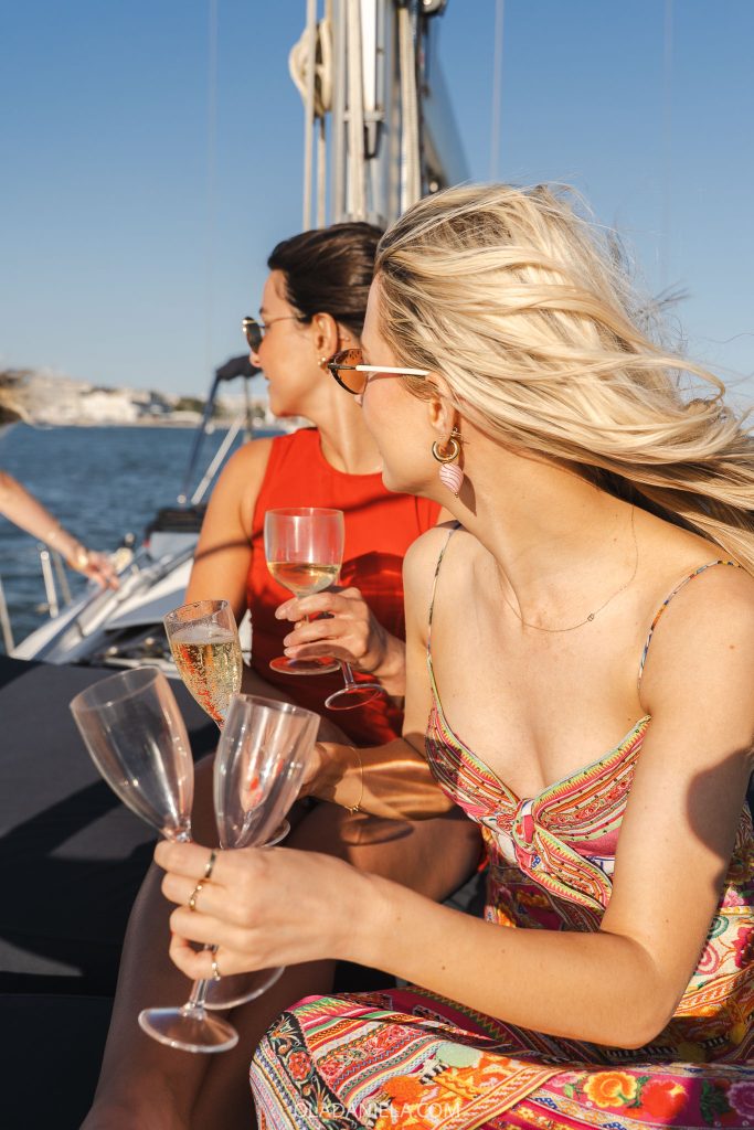Girls on a Lisbon boat tour with champagne