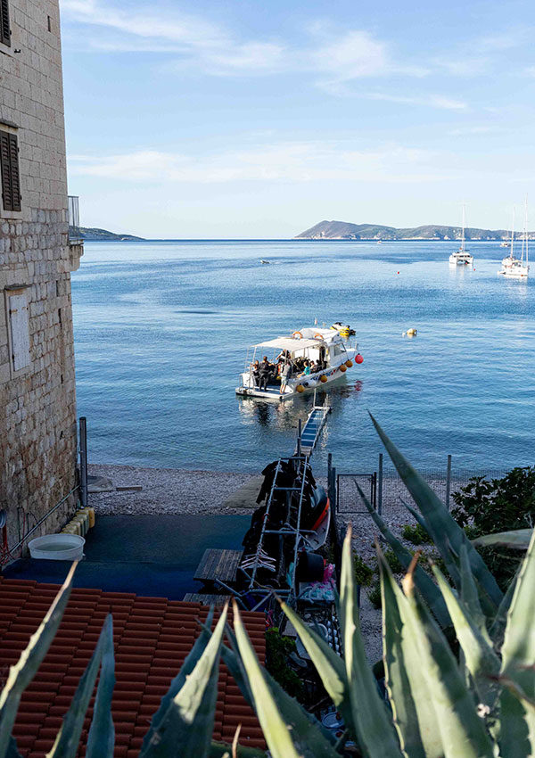 Diving boat leaving Komiza on Vis Island in Croatia