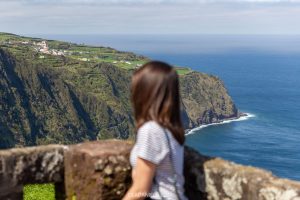 A woman looking out from a viewpoint São Miguel, Azores