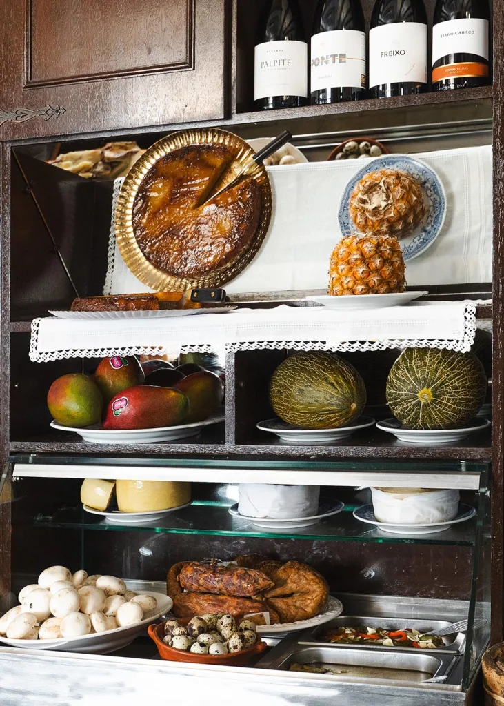 Sit at the counter of Botequim da Mouraria and try traditional Alentejo dishes in Evora